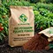 X-HUMATE 25kg kraft paper bag Bio Potassium Fulvate Powder organic fertilizer for agricultural soil conditioning in a vegetable field.